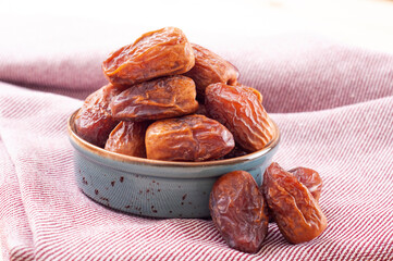 Healthy dates in porcelain bowl