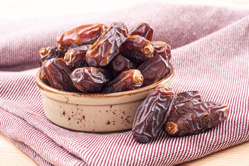 Healthy dates in porcelain bowl