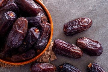 Black stone table and dried dates on it.