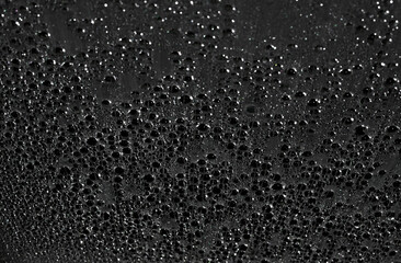 deep black background with sparkling drops on dark