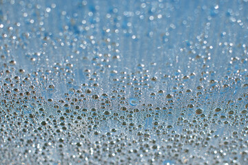 contrasting drops on the background of the blue sky are luminous and bright
