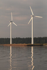 Wind generators are located on the shores of the Baltic Sea.