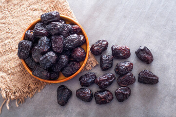Black stone table and dried dates on it.
