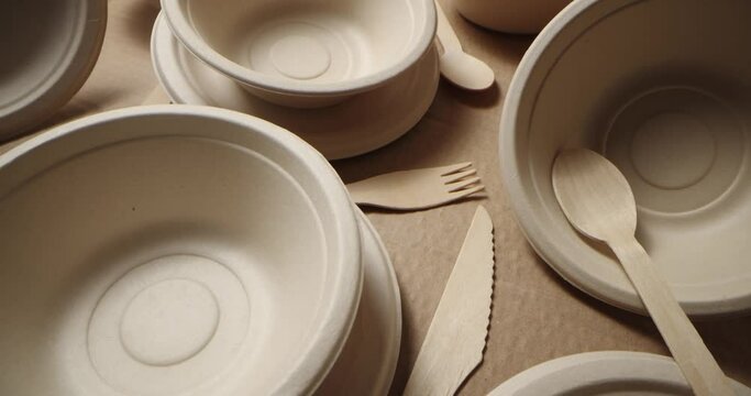 eco-friendly disposable tableware. recycled paper dishes and wooden cutlery