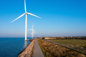 Aerial view of the wind turbines. Green ecological power energy generation. Wind farm eco field....