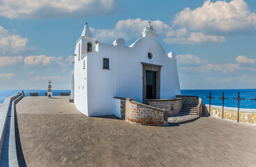 The church of the Madonna del Soccorso is a religious architecture located in Forio in Italy. Island of Ischia. Square with white church. - obrazy, fototapety, plakaty