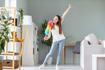 Full length body size view of attractive cheerful funky girl cleansing dust singing in brush having fun at home living room indoors - obrazy, fototapety, plakaty