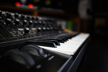Buy new professional synthesizer piano in dj store to produce modern electronic music tracks in studio