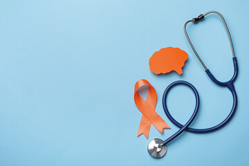 Orange ribbon, stethoscope and paper brain cutout on light blue background, flat lay with space for text. Multiple sclerosis awareness - obrazy, fototapety, plakaty