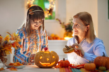 Family carving pumpkin for Halloween