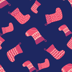 Christmas seamless pattern with red Christmas socks with snowflakes, specks