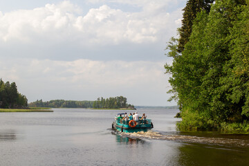 boat with tourists on the lake, travel by water. Saint Petersburg, July 20, 2021