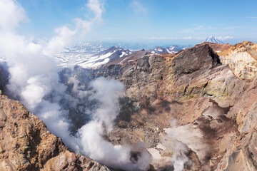 Aerial drone photo of Mutnovsky volcano crater with fumaroles