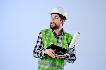 male worker in a white helmet blueprints Professional studio industry