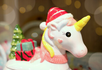 Christmas toy unicorn Christmas and bokeh. Greeting Christmas card