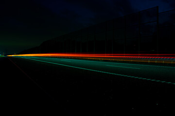 Night road lights. Lights of moving cars at night. long exposure red, blue, orange, multicolored