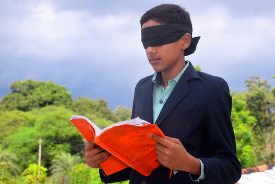 13 Year Old Child With Blindfold Reading Book, On The Roof In The Rainy Season, Indecision And Uncertainty Conceptual, Selective Focus