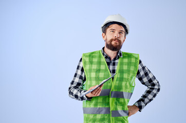 engineer in a green vestconstruction work design blue background