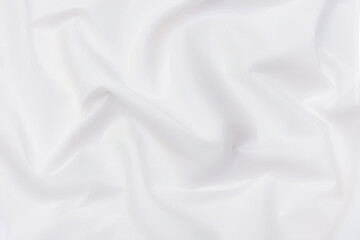 Fototapeta na wymiar Abstract and soft focus wave of white or ivory fabric background, white texture and detail