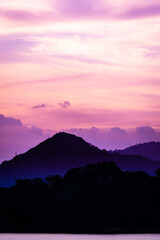 silhouette mountain with attractive background, sunset with vivid purple sky