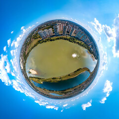 small planet aerial panorama of the southern outskirts of the city of Krasnodar, a large recreation park and the Kuban river sunny summer day