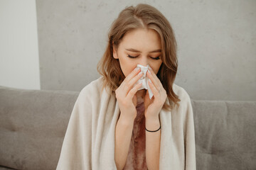 beautiful girl blows her nose

