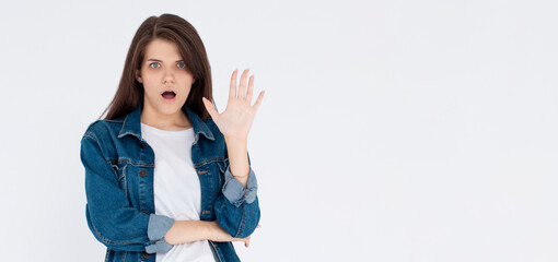 Obraz premium Stop right now. Offended and shocked woman showing block gesture, telling no, frowning and looking insulted with disgusting offer, refusing, standing against white background.