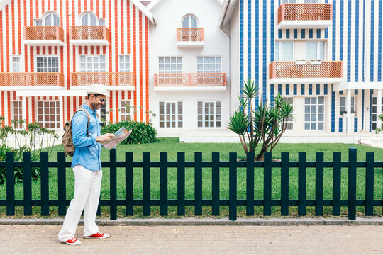 Stylish tourist exploring promenade of old city