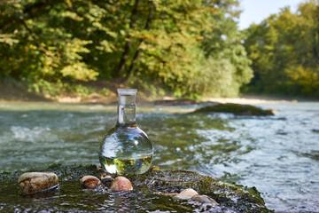 Flask with clear river water.