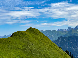 two people on the top of green mountains Fellhorn Alps Germany