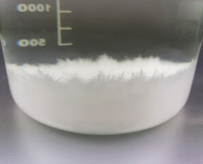 Ammonium chloride crystals in water salmiac salt crystallization precipitation sal ammonia stock...