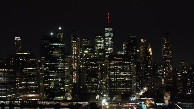 Night Drone Shot Of New York City Skyline Showing Freedom Tower And Hudson River, Filmed from Brooklyn