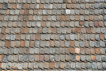 Close up old background tiled roof of a house, Europe