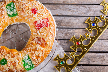 Traditional Spanish Epiphany cake, Roscon de Reyes with festive decorations 