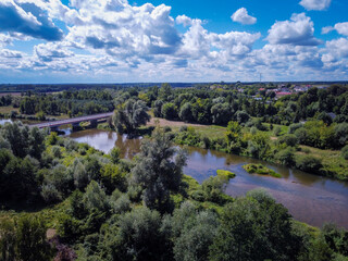 The small town of Burzenin is located on the Warta River.  - obrazy, fototapety, plakaty