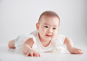 Closeup of cute Asian baby playing on the floor