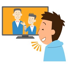 テレビでお笑い番組を見る男性1
