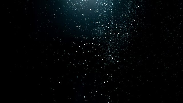 Super slow motion of abstract silver particles on black background. Filmed on high speed cinematic camera at 1000 frames per second.