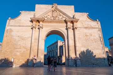 Lecce (Italy). Porta Napoli arc in the sunset 