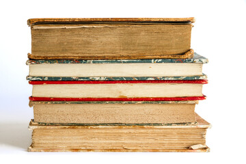 Stack of old books on white background