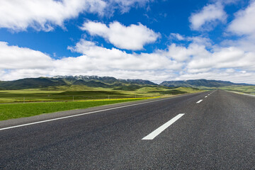 Fototapeta premium Tarmac road under blue sky