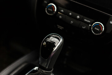 Gear shift handle in a modern car, closeup photo
