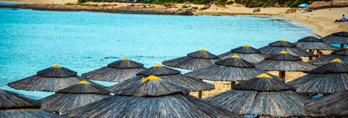 Beach umbrellas at the seaside in summer