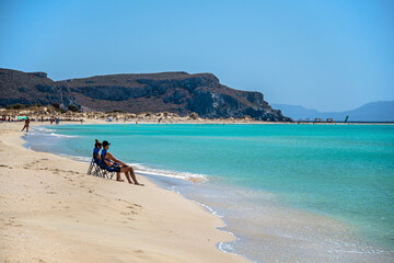 People spend the summer holidays at the seaside