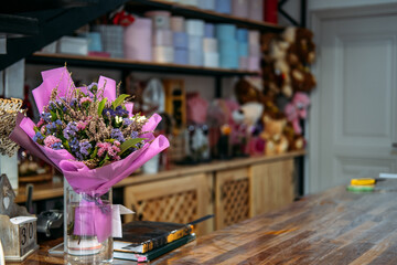 Naklejka na ściany i meble Floral Design, floral fashion, florist shop interior. Flower arrangement, Flower shop decoration, bouquets, potted plants