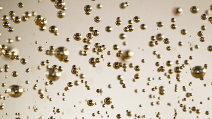 Freeze motion of champagne bubbles going up, macro shot.