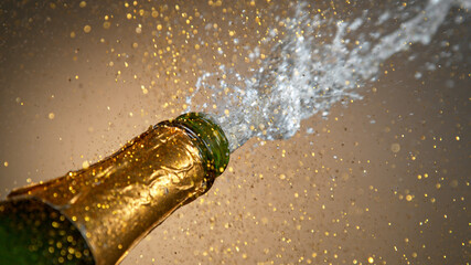 Freeze motion of Champagne explosion with flying cork closure, opening champagne bottle closeup,...