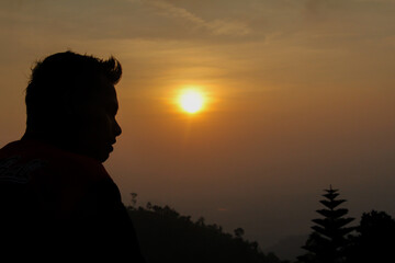 someone looking at the sunset