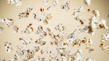 Freeze Motion of Popcorn Flying on Gradient Beige Background, close-up.