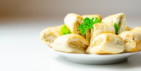 Cocktails sausage rolls, seasoned pork sausage meat wrapped in puff pastry